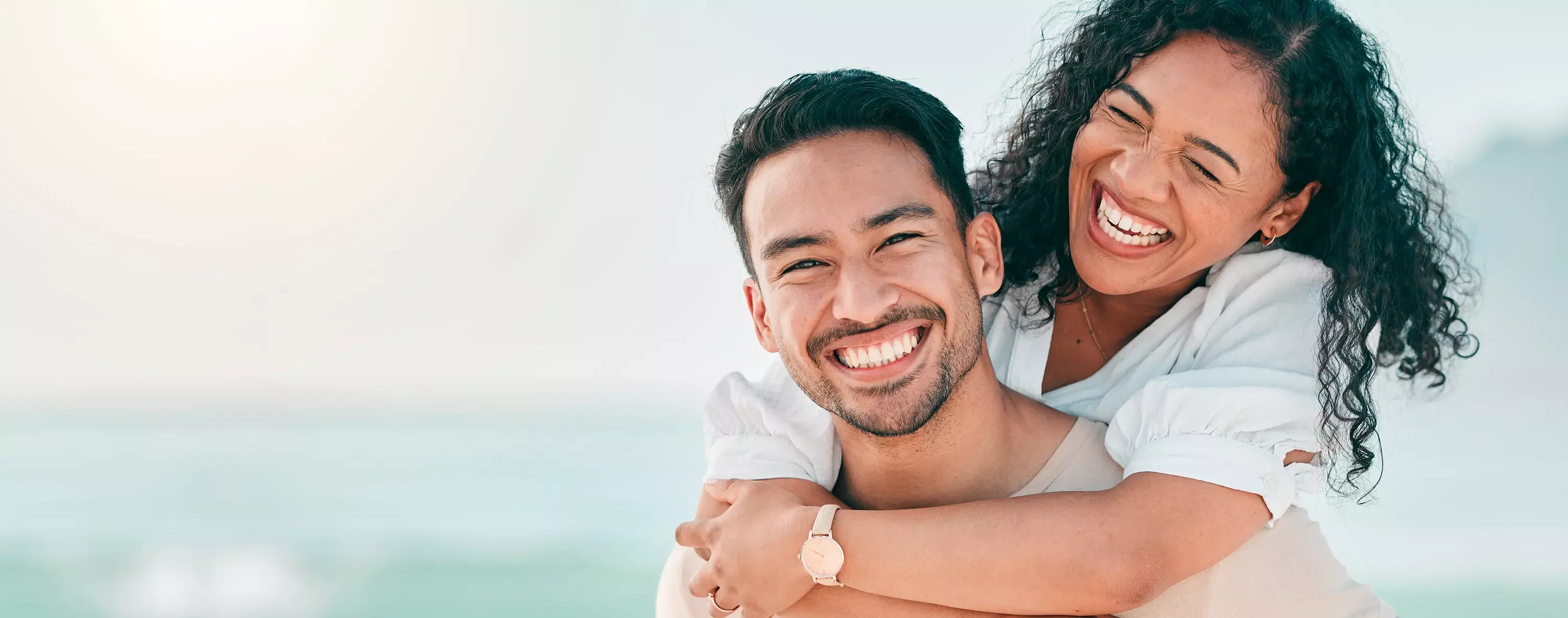 Younger couple hugging